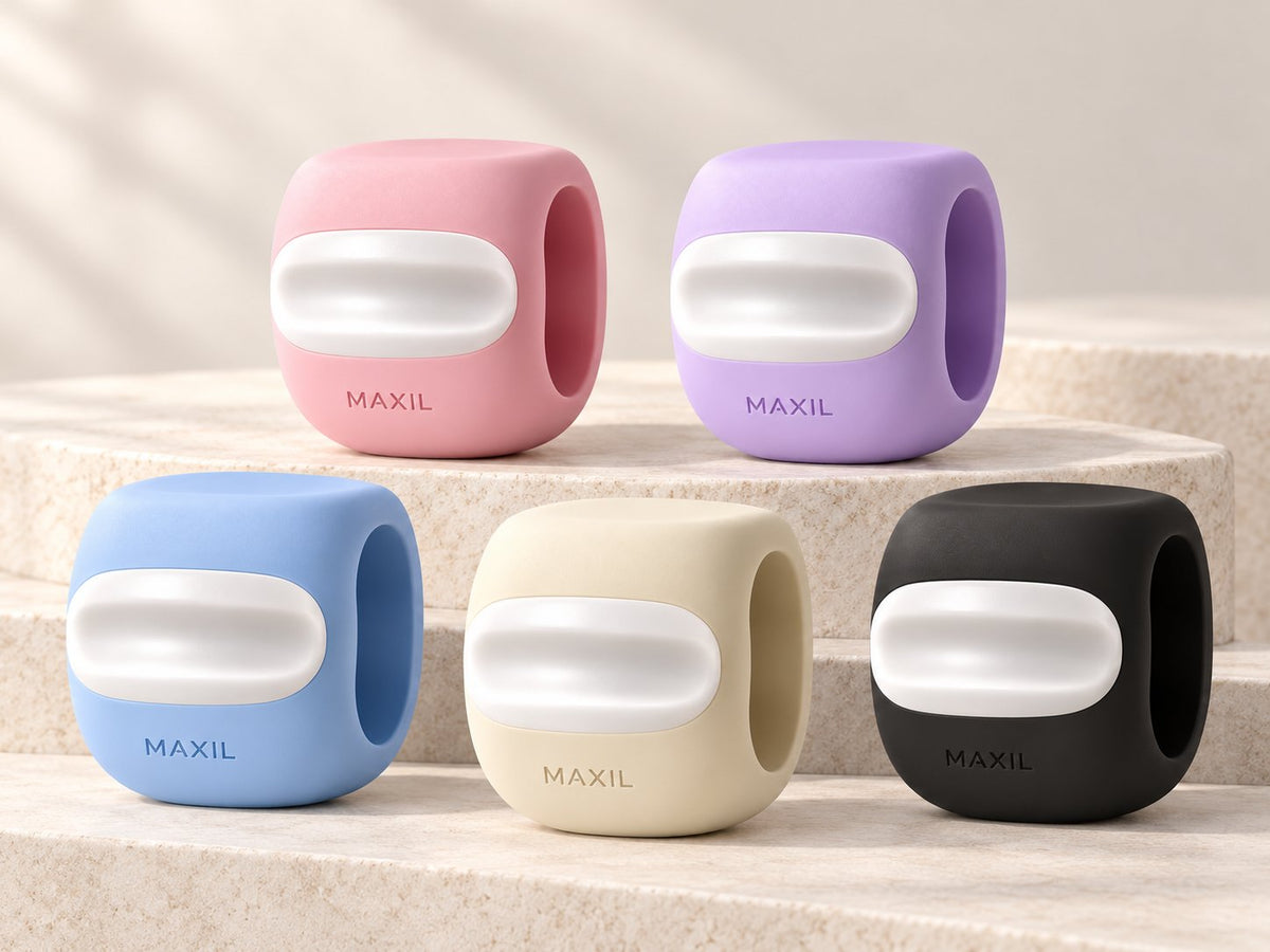 Les cinq MAXIL Pulse rose, violet, bleu, ivoire et noir sur des marches en pierre